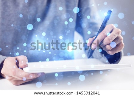 Innovation technology in modern corporate business. Virtual geometric graphic hologram. Businessman works in office with laptop. Abstract concept of internet network. Double exposure image