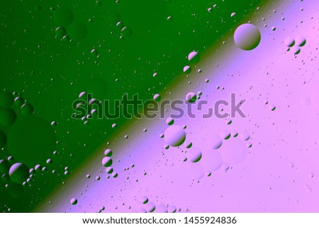 Oil on water flat colorful duotone macro abstract background photographic image.