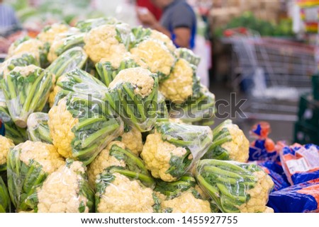 White cauliflower. Natural vegetables, natural vitamins. A living fragment from a fruit and vegetable store. White cauliflower. . For sale in the market. Natural