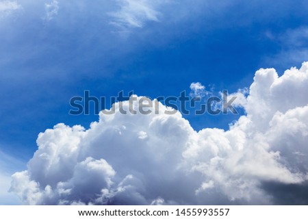 Regular summer clouds on blue sky at daylight in continental europe. Close shot wit telephoto lens