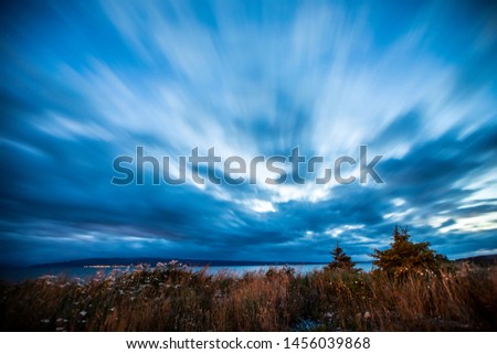 Long Exposure photograph at Sandspit, Moresby Island, Haida Gwaii, British Columbia. Clouds moving overhead at twilight.