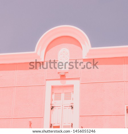 The geometric part of the facade of the pink building. Minimalism