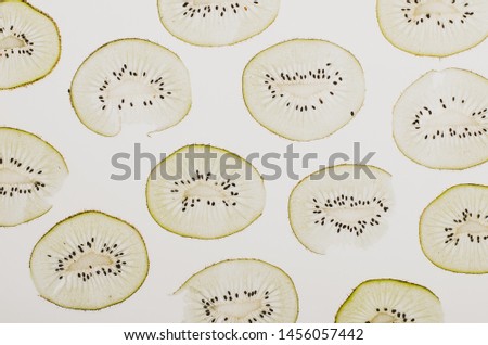 Top view on tiny cut fruits on a white background