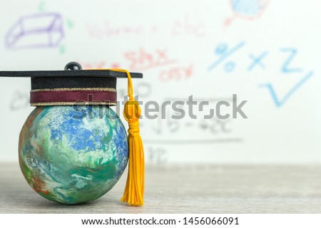 Study abroad education ideas, Graduated cap on top global world in formula arithmetic equation background. Concept of success in online, e-learning mathematics knowledge long distane learning anywhere