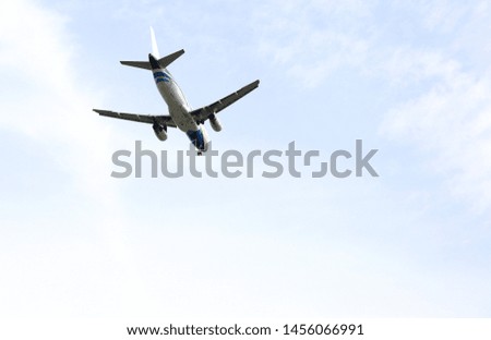 Commercial airplane flying in blue sky. High resolution of image. Travel and transportation concept, with copy space.