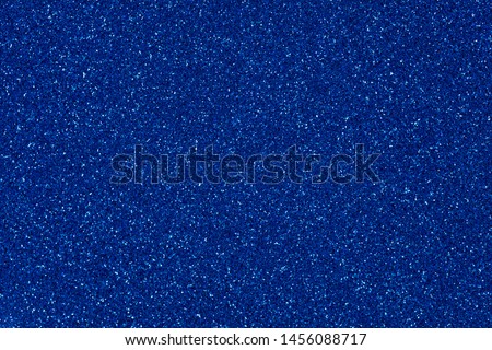 Contrast blue glitter background for elegant decorations, new texture in stylish tone. High resolution photo.
