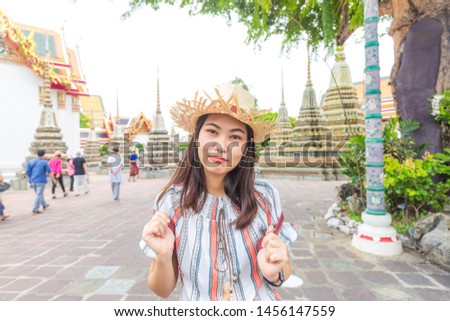 Asian beautiful tourist women walking travel in buddhist temple sightseeing in Bangkok, Thailand