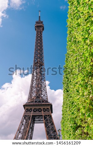 Eiffel Tower in colors. Spring in Paris. Blue sky and clouds. Travel and tourism. Copy space