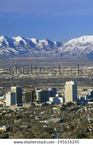 Skyline of Salt Lake City, UT with snow-capped Wasatch Mountains in background