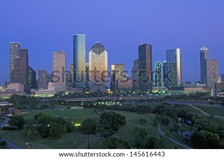 Houston skyline with Memorial Park in foreground at dusk in Texas