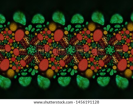 A hand drawing pattern made of green red orange and brown on a black background
