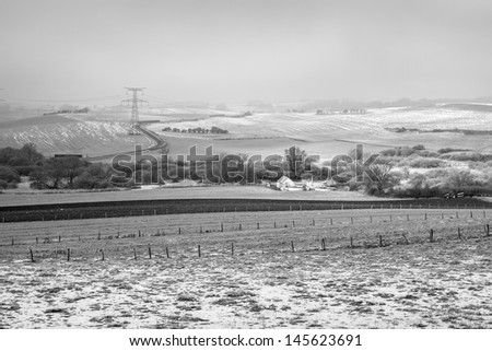 Snow covered farm in Lorraine, France (black and white)