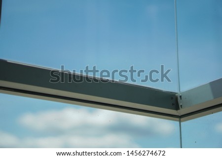 The movement of clouds and sky through large windows that reflect the thoughts of the human mind.