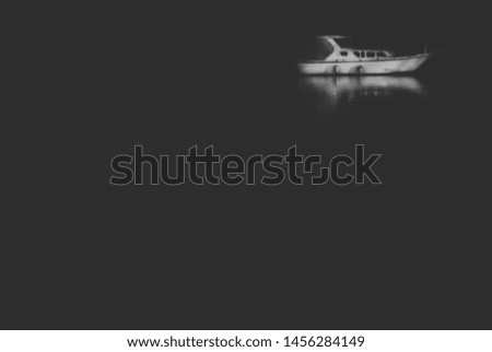White boat on dark water