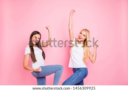 Photo of two ladies overjoyed by cool achievement wear casual outfit isolated pink background