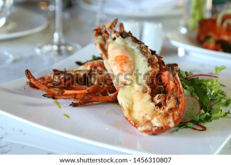 Closeup delicious cheese tiger prawn.
Cheesy Baked Tiger shrimp with cheese.