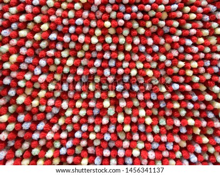 Close-up photos of colorful dots carpet or doormat pattern. Colorful carpet background texture.