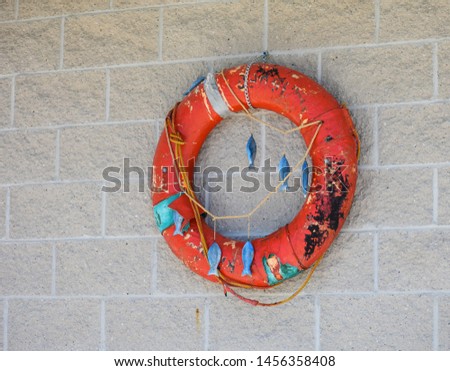 Swimmer's LIfe Ring Hanging on Wall