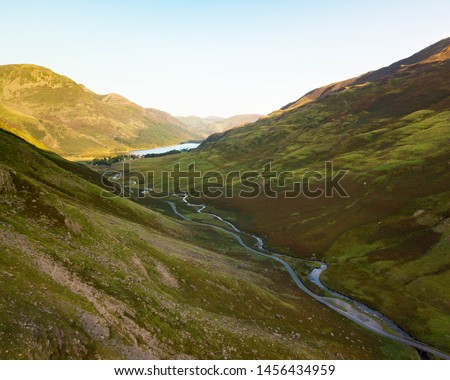 DJI Mavic drone image of the mountain pass at Honister in the English Lake District. Early summer’s morning with the first light illuminating the distant fells.