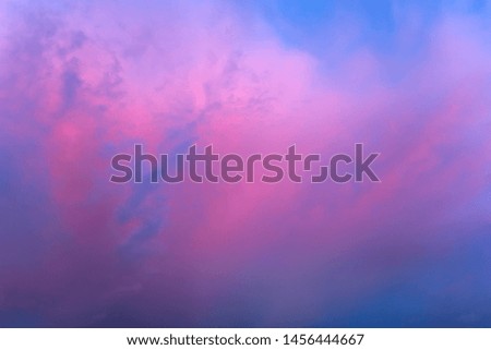 Scenic clouds in the sunset sky. A close-up photo of red clouds.