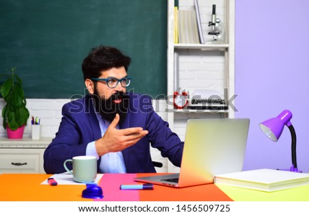 Surprised male student in auditorium. Educational process. Male student learning in classroom. Teacher. Education, knowledge concept. Coffee break. Back to school. Student thinking about coursework.