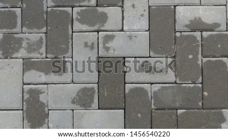 texture and background of paving tiles after the rain