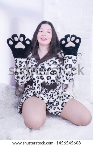 Asian girl wears Cat Paw Gloves for Cosplay on White Background