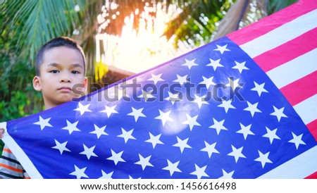 Asian american boy with usa flag.
