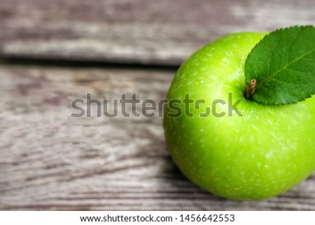 Top view Green Apple (Malus pumila) on wooden table with blurred background.Sweet,sour and freshness taste.Have a lot of fiber, vitamins and minerals.Food,Fruits or healthcare concept.Have copy space.