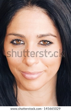 Portrait of an attractive woman on black background