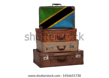 Tanzania, Tanzanian travel concept. Group of vintage suitcases isolated on white background