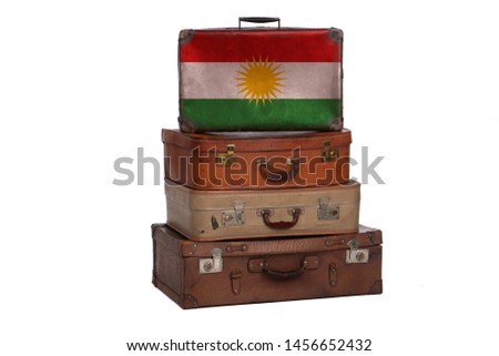 Kurdistan, Kurdish travel concept. Group of vintage suitcases isolated on white background