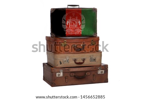 Afghanistan, Afghani travel concept. Group of vintage suitcases isolated on white background