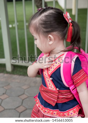 Asia baby girl Child carrying bag.