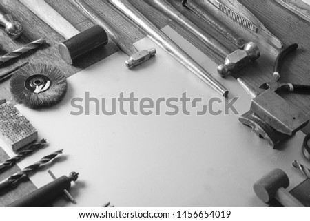 Antique tools for making rings, detail of antique jewelery copyspace goldsmith background
