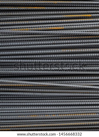 Steel reinforcement folded on the construction site. Rusty steel bars for concrete reinforcement. The texture of the steel reinforcement
