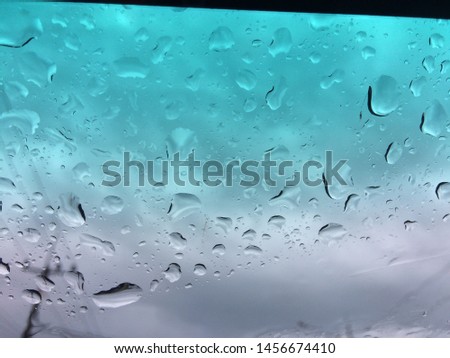 Rain drops on window sureface glasses car