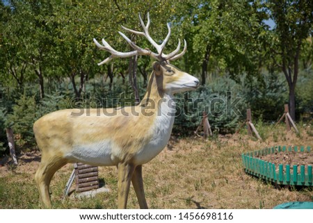 Deer Statue in a Professional Garden . pictured in the photo Deer statue decorative.