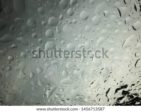 abstract water drops on the glass in rainy day season