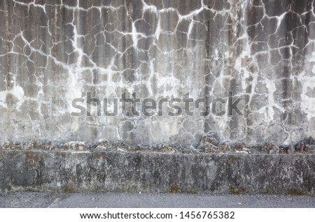 weathered gray wall with cracks in grungy style