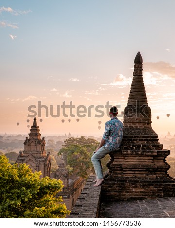 Bagan Myanmar Men watching sunrise over the temples of Pagan the historical Unesco site