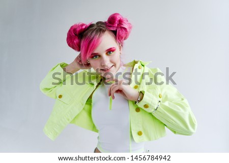 woman with pink hair smiling