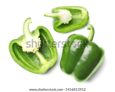 Whole and cut green bell peppers on white background, top view Royalty-Free Stock Photo #1456813952