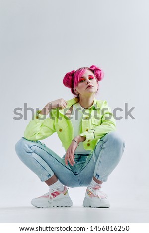 woman with pink hair sitting on the floor fashion retro style