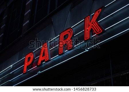 Red neon sign parking. NY