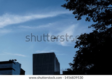 Airplane flying in the trees on top of Skycrapers in Midtown..