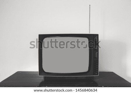 Retro old television receiver on the table front, vintage design black and white space for text