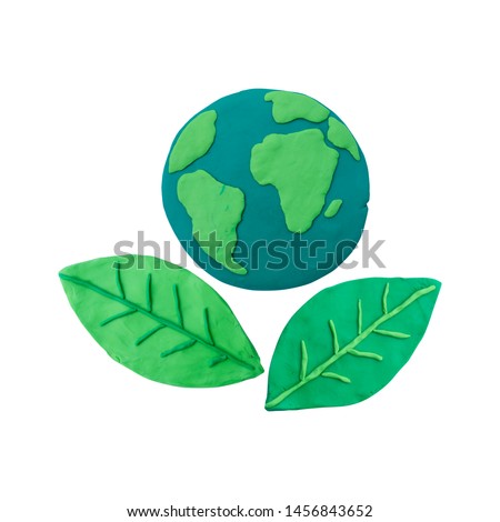 The world or the green planet is made of clay plasticine.global and leaf made from plasticine clay on white background