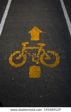 Bicycle sign and arrow on bicycle lane