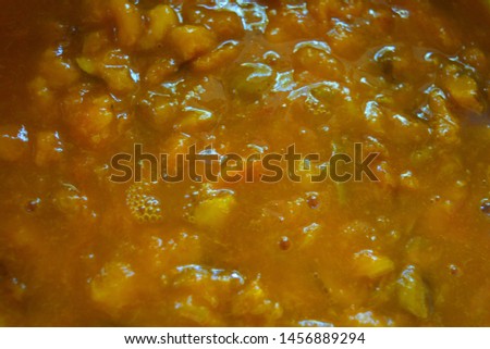 Home-made boiled jam, natural apricot and sugar jam, yellow unusual tasty background.